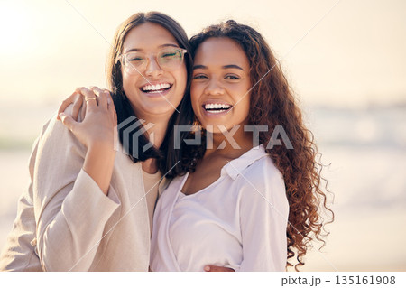 Portrait, lesbian and women hug, beach and love with freedom, equality and romance with happiness. Face, couple and girls embrace, lgbtq relationship and commitment with pride and seaside vacation Portrait, lesbian and women hug, beach and love with freedom, equality and romance with happiness. Face, couple and girls embrace, lgbtq relationship and commitment with pride and seaside vacation 135161908