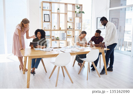 Documents, meeting and people in workspace for business startup, project management and review, teamwork or planning. Diversity, group of women and men or team talking on digital tablet or paperwork 135162090