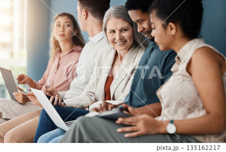Hiring, technology and row business people for job interview, vacancy and opportunity in office. Recruitment, diversity and men and women talking with phone, tablet and laptop prepare for hr meeting 135162217