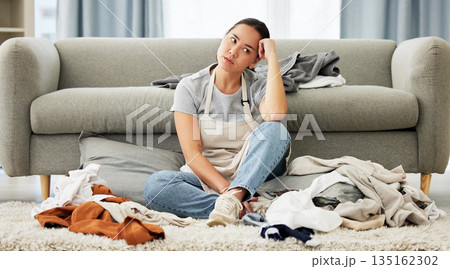 Woman, cleaning and bored with chaos, home and floor with housekeeping, domestic cleaner and tired. Female person, lady or maid in the living room, laundry and exhausted with fatigue and messy lounge 135162302