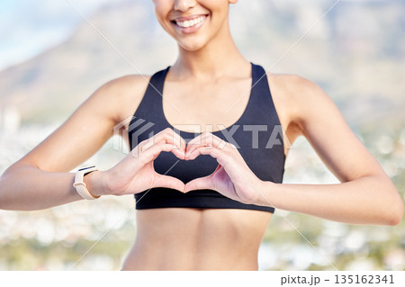Woman, fitness and heart hands in nature for workout, exercise or cardio training in the outdoors. Hand of fit, active and sporty female person, athlete or runner with loving emoji or sign for health Woman, fitness and heart hands in nature for workout, exercise or cardio training in the outdoors. Hand of fit, active and sporty female person, athlete or runner with loving emoji or sign for health 135162341