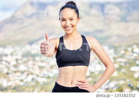 Happy woman, fitness and thumbs up for workout, success or winning on mountain training in nature. Portrait of female person, athlete or runner with thumb emoji, yes sign or like for healthy wellness Happy woman, fitness and thumbs up for workout, success or winning on mountain training in nature. Portrait of female person, athlete or runner with thumb emoji, yes sign or like for healthy wellness 135162352