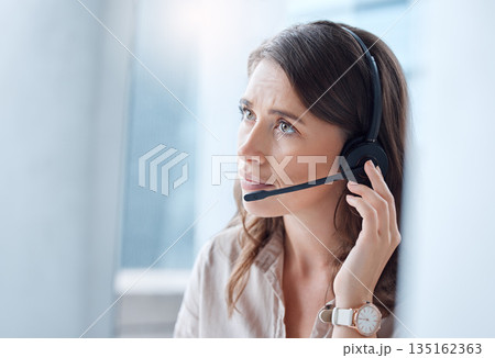 Worry, call center and woman with telemarketing, customer service and stressed in a workplace. Female person, employee or agent with headphones, tech support and help desk with advice or mistake Worry, call center and woman with telemarketing, customer service and stressed in a workplace. Female person, employee or agent with headphones, tech support and help desk with advice or mistake 135162363