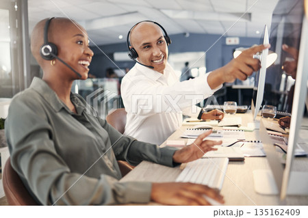 Teamwork, call center and computer for advice or help with account information or sales. Black man and person on training or coaching for customer service ,telemarketing or help desk consultant at pc Teamwork, call center and computer for advice or help with account information or sales. Black man and person on training or coaching for customer service ,telemarketing or help desk consultant at pc 135162409