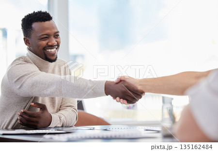 Black man, handshake and partnership, success in interview with onboarding, promotion and working together. Collaboration, professional team and business people shaking hands in office with hiring Black man, handshake and partnership, success in interview with onboarding, promotion and working together. Collaboration, professional team and business people shaking hands in office with hiring 135162484