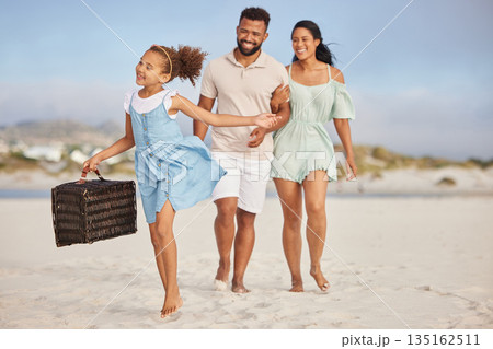 Happy family, parents or child walking on beach to relax on fun holiday vacation or picnic together. Dad, mom or excited young girl bonding, smiling or holding basket outdoors in summer at seashore 135162511