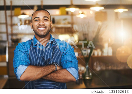 Coffee shop, barista and portrait of happy black man in restaurant for service, working and crossed arms. Small business owner, bistro and professional male waiter smile in cafeteria ready to serve 135162618