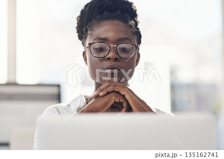 Thinking, decision and business woman on computer for solution, research and serious, focus or job planning. Reading, review and choice of african person or analyst on laptop for data problem solving 135162741