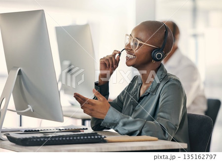 Call center, talking and a happy woman with headset at computer for customer service or crm. Black person support agent at pc for account information, promotion or sale for telemarketing or help desk Call center, talking and a happy woman with headset at computer for customer service or crm. Black person support agent at pc for account information, promotion or sale for telemarketing or help desk 135162797