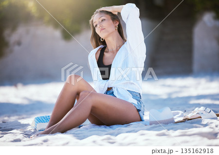 Woman relax on beach, travel and summer vacation with tourism and adventure, calm outdoor with zen. Female person with peace, tropical holiday in Mexico and journey to seaside, sunbathing and rest 135162918