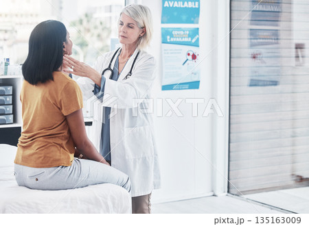 Consulting, thyroid and woman with doctor in hospital for sick, cancer or medical test. Healthcare, medicine and virus with physician and checking throat of patient in clinic for emergency and injury Consulting, thyroid and woman with doctor in hospital for sick, cancer or medical test. Healthcare, medicine and virus with physician and checking throat of patient in clinic for emergency and injury 135163009