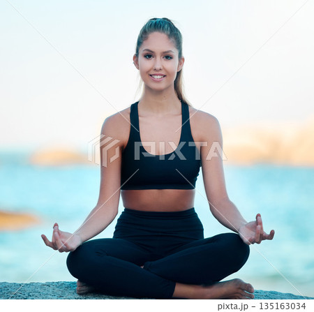 Yoga, lotus and portrait of woman at beach for zen fitness, exercise and mindfulness, holistic meditation and peace. Meditate, ocean and calm person for mental health, training for body wellness 135163034