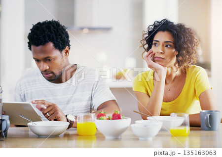Technology, breakfast and man ignore woman for social media, reading news and digital app in morning. Marriage, couple and sad female and male on tablet with relationship problem, ignoring and issues 135163063