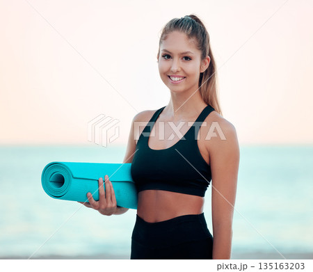 Beach, yoga mat and portrait of woman outdoor for health, fitness and ocean mockup. Face, pilates and happy female athlete from Canada ready to start exercise, body workout or training at sunset. Beach, yoga mat and portrait of woman outdoor for health, fitness and ocean mockup. Face, pilates and happy female athlete from Canada ready to start exercise, body workout or training at sunset. 135163203