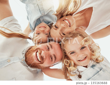 Family portrait, heads together in circle from below and happiness, bonding and holiday travel to Australia. Face of mother, father and children with smile, happy outdoor huddle on summer vacation. Family portrait, heads together in circle from below and happiness, bonding and holiday travel to Australia. Face of mother, father and children with smile, happy outdoor huddle on summer vacation. 135163688
