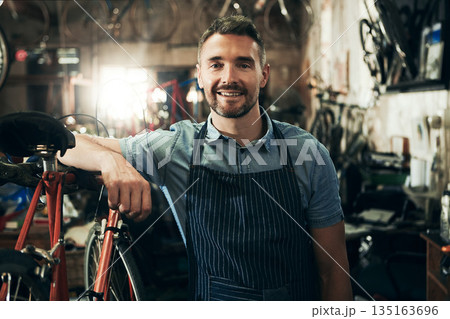 Portrait, smile and repair man in bicycle shop working in store or cycling workshop. Face, bike mechanic and confident male person, business owner or mature professional technician from Australia. Portrait, smile and repair man in bicycle shop working in store or cycling workshop. Face, bike mechanic and confident male person, business owner or mature professional technician from Australia. 135163696