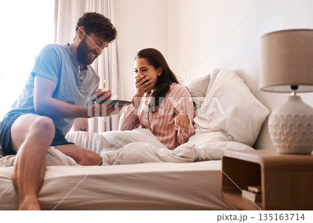 Couple, bedroom and surprise birthday candle, cupcake or celebration dessert for excited woman shocked over food gift. Muffin, wow and people smile, happiness and celebrate special day on home bed Couple, bedroom and surprise birthday candle, cupcake or celebration dessert for excited woman shocked over food gift. Muffin, wow and people smile, happiness and celebrate special day on home bed 135163714
