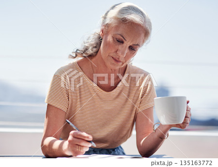Writing, book and an elderly woman author sitting outdoor in summer for inspiration as a writer. Idea, planning and a female pensioner drinking coffee while using a pen to write in a journal outside 135163772