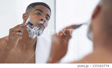 Man is shaving with cream, mirror and beauty, hair removal for hygiene and grooming during morning routine at home. Male person in bathroom, razor to shave and foam with fresh and clean skincare Man is shaving with cream, mirror and beauty, hair removal for hygiene and grooming during morning routine at home. Male person in bathroom, razor to shave and foam with fresh and clean skincare 135163774