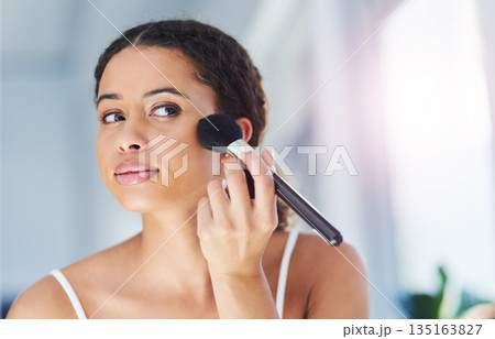Glamour, makeup and woman with a cosmetic brush for a natural, skin and face in her bathroom. Young, beauty and beautiful female person with cosmetics powder for a morning routine in her apartment. 135163827