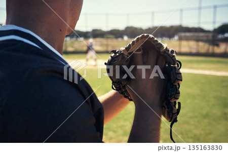 Pitch, glove and hands of man on baseball field for competition, training and games. Action, exercise and championship with male athlete throwing in stadium park for fitness, closeup and sports club Pitch, glove and hands of man on baseball field for competition, training and games. Action, exercise and championship with male athlete throwing in stadium park for fitness, closeup and sports club 135163830