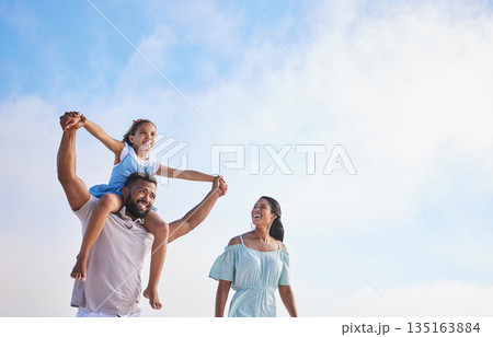 Piggyback, beach or parents walking with a girl for a holiday vacation together with happiness in summer. Holding hands, mother and father playing or enjoying family time with a happy child or kid 135163884