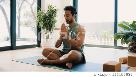 Mindfulness, yoga and man in home, namaste and meditation for inner peace, calm and wellness on mat. Zen, person and spiritual awareness for mental health, yogi and prayer hands for stress relief 135163955