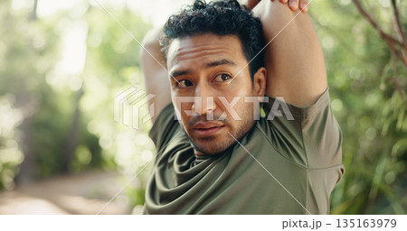 Man, fitness and stretching with arms in nature for workout preparation, start or begin in forest. Active, male person or runner getting ready with warm up for hiking, outdoor training or exercise 135163979