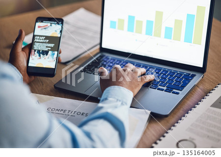 Man, business and hands with a laptop, smartphone and graphs with connection, finance and market research. Male person, employee and accountant with a pc, competitor analysis and consumer behavior 135164005