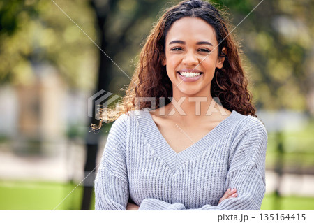 Happy, portrait of black woman and arms crossed in a nature park outdoors. Happiness or positive, confident or proud and excited or cheerful African female person outside for health wellness. Happy, portrait of black woman and arms crossed in a nature park outdoors. Happiness or positive, confident or proud and excited or cheerful African female person outside for health wellness. 135164415
