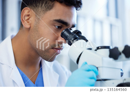 Science, innovation and a man with microscope in a lab for medical research and analysis. Serious, medicine and a scientist doing a check of chemistry, microbiology or a virus working at a clinic Science, innovation and a man with microscope in a lab for medical research and analysis. Serious, medicine and a scientist doing a check of chemistry, microbiology or a virus working at a clinic 135164560