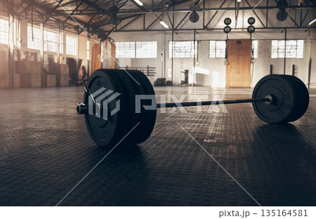 Weightlifting, fitness and barbell on floor of gym for training, workout and bodybuilding. Muscle, strong and weights with sports equipment in empty room for exercise, challenge and performance Weightlifting, fitness and barbell on floor of gym for training, workout and bodybuilding. Muscle, strong and weights with sports equipment in empty room for exercise, challenge and performance 135164581