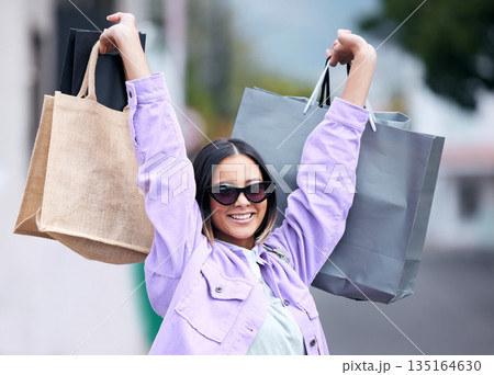 Bags, happy and woman shopping in the city for fashion, retail and brands of clothes on sale, discount or promotion. Smile, girl and shopper with luxury, boutique or designer products from store Bags, happy and woman shopping in the city for fashion, retail and brands of clothes on sale, discount or promotion. Smile, girl and shopper with luxury, boutique or designer products from store 135164630