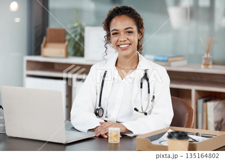 Doctor, woman in portrait and smile, healthcare and medical professional in office with stethoscope and laptop. Female person in medicine, desk and health insurance with cardiologist at hospital 135164802