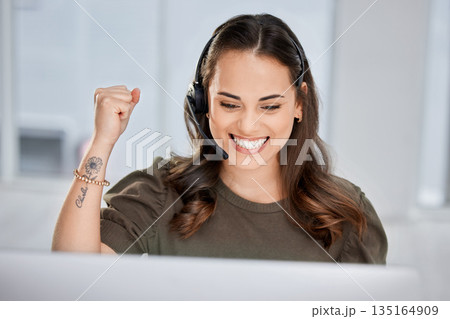 Happy, success or excited consultant in call center on target for winning a telemarketing or telecom bonus. Computer, winner or happy virtual assistant with a smile for victory or goals achievements 135164909