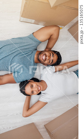 Top view, home and couple with boxes, real estate and excited on the floor, living room and mortgage. Portrait, man and woman on the ground, cardboard and relationship with property and apartment 135165075