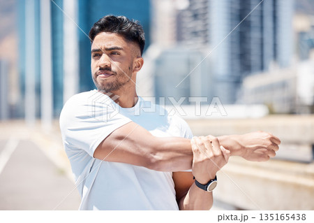 Man, fitness and stretching arms in city for running, cardio workout or exercise in the outdoors. Fit, active or sporty male person, athlete or runner in warm up arm stretch before training in town 135165438