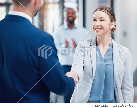 Thank you, coworkers shaking hands and at office of their work together. Partnership or support, crm or agreement and cheerful colleagues with a handshake for greeting at their modern workplace Thank you, coworkers shaking hands and at office of their work together. Partnership or support, crm or agreement and cheerful colleagues with a handshake for greeting at their modern workplace 135165469