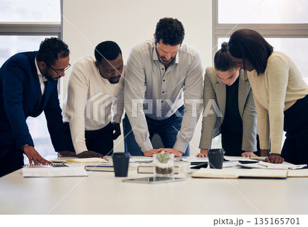 Business people, paperwork and meeting in team planning, project or collaboration at the office. Group of diverse employee workers in teamwork, documents or brainstorming together at the workplace Business people, paperwork and meeting in team planning, project or collaboration at the office. Group of diverse employee workers in teamwork, documents or brainstorming together at the workplace 135165701
