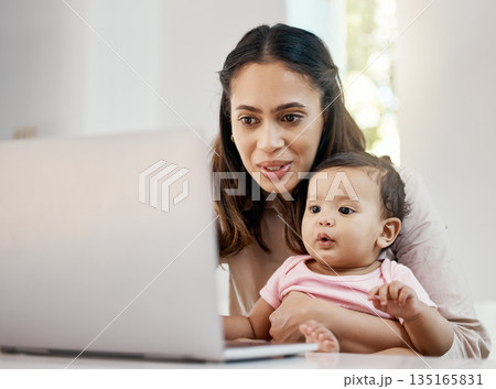 Smile, remote work and mother with baby and laptop, happy freelancer worker with online project in apartment. Working at home, woman and kid girl with happiness, internet and virtual job in kitchen. 135165831