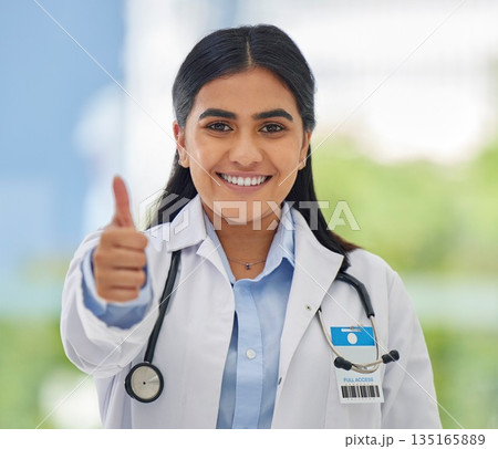 Woman, doctor portrait and thumbs up with hospital success, motivation and yes in clinic. Emoji, winner and like hand sign of a professional healthcare and wellness worker feeling happy from job 135165889