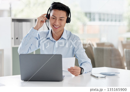 Asian man, call center and laptop with document in customer service, telemarketing or support at office. Happy male person or consultant agent with paperwork on computer in online advice at workplace Asian man, call center and laptop with document in customer service, telemarketing or support at office. Happy male person or consultant agent with paperwork on computer in online advice at workplace 135165900