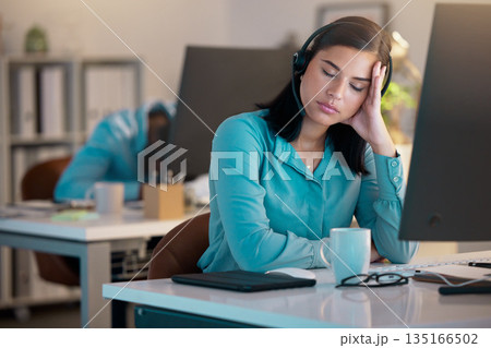 Call center, sleeping and tired woman in office for customer service or support at night. Telemarketing, sleep and fatigue of female sales agent, consultant burnout and employee stress for deadline Call center, sleeping and tired woman in office for customer service or support at night. Telemarketing, sleep and fatigue of female sales agent, consultant burnout and employee stress for deadline 135166502