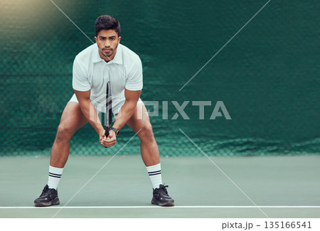 Sports, space and man at court for tennis, training and mockup, mindset and focus on green background. Fitness, workout and Indian male player with racket for match, competition and body exercise 135166541