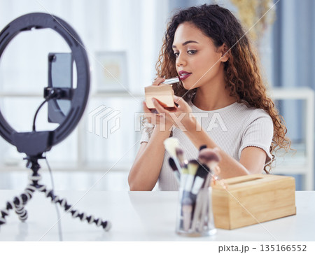 Makeup influencer, lipstick and woman streaming tutorial for beauty, fashion and broadcast for cosmetics. Live stream, filming and content creator or make up artist vlogging with phone and ring light Makeup influencer, lipstick and woman streaming tutorial for beauty, fashion and broadcast for cosmetics. Live stream, filming and content creator or make up artist vlogging with phone and ring light 135166552