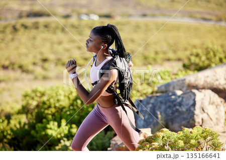 Black woman, mountain runner and outdoor for fitness, speed or challenge for wellness with focus in summer. African girl, workout and running for training, sunshine and exercise on hiking adventure Black woman, mountain runner and outdoor for fitness, speed or challenge for wellness with focus in summer. African girl, workout and running for training, sunshine and exercise on hiking adventure 135166641