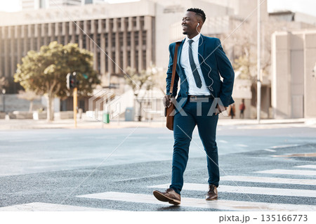 Happy businessman, walking and city to work for travel on street or pedestrian crossing outdoors. Black man on cross road, walk or traveling to business with suit and smile on asphalt in urban town 135166773