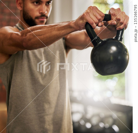 Fitness, muscle and man with kettle bell in gym for exercise, bodybuilder training and workout. Sports, motivation and serious male person lifting weights for wellness, healthy body and strength Fitness, muscle and man with kettle bell in gym for exercise, bodybuilder training and workout. Sports, motivation and serious male person lifting weights for wellness, healthy body and strength 135166795