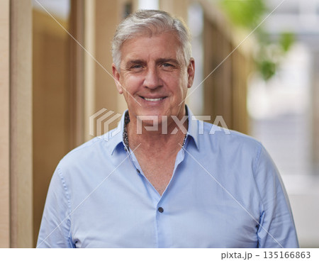 Happy, mature and portrait of a businessman at work for corporate and professional career. Smile, office and an expert employee at a company with happiness, confidence and executive job at an agency 135166863
