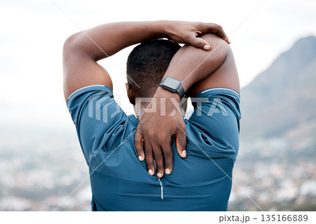 Stretching, fitness and back of black man in nature for exercise, marathon training and running. Sports, mountain and male person stretch arms for warm up, cardio workout and start for wellness Stretching, fitness and back of black man in nature for exercise, marathon training and running. Sports, mountain and male person stretch arms for warm up, cardio workout and start for wellness 135166889